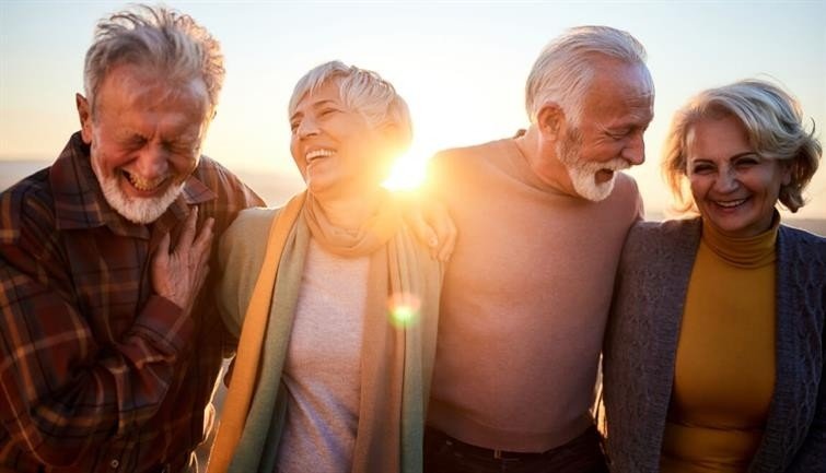 Two-older-couples-outside-smiling